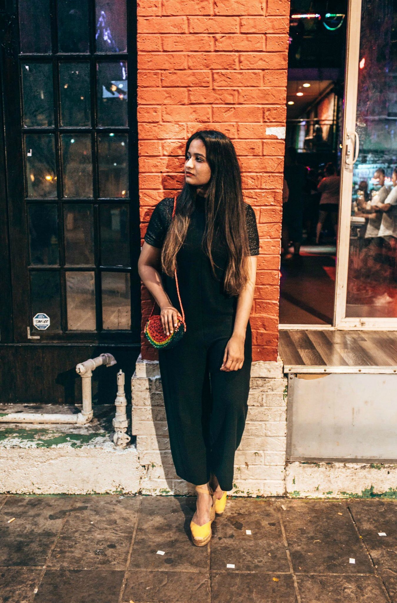 wearing Madewell Texture & Thread Side-Tie Jumpsuit in black q1 - A Day in Austin and San Antonio -Attractions, Where to Eat and What to Wear featured by popular US travel blogger, Dreaming Loud