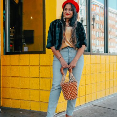 wearing levis Wedgie Icon Fit High Waist Crop Jeans, velvet camisole, Faux Fur bolero, red beret, Staud moreau bag