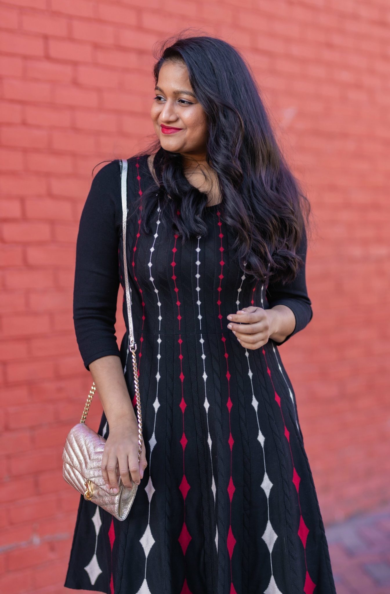 5 Cute Christmas Party Outfits by popular Maryland modest fashion blog, Dreaming Loud: image of a woman wearing Banana Republic topcoat in Hit pink,DANNY AND NICOLE diamond sweater dress,Fuchsia Pink Satin pumps, Rebecca minkoff Edie Chain Wallet.