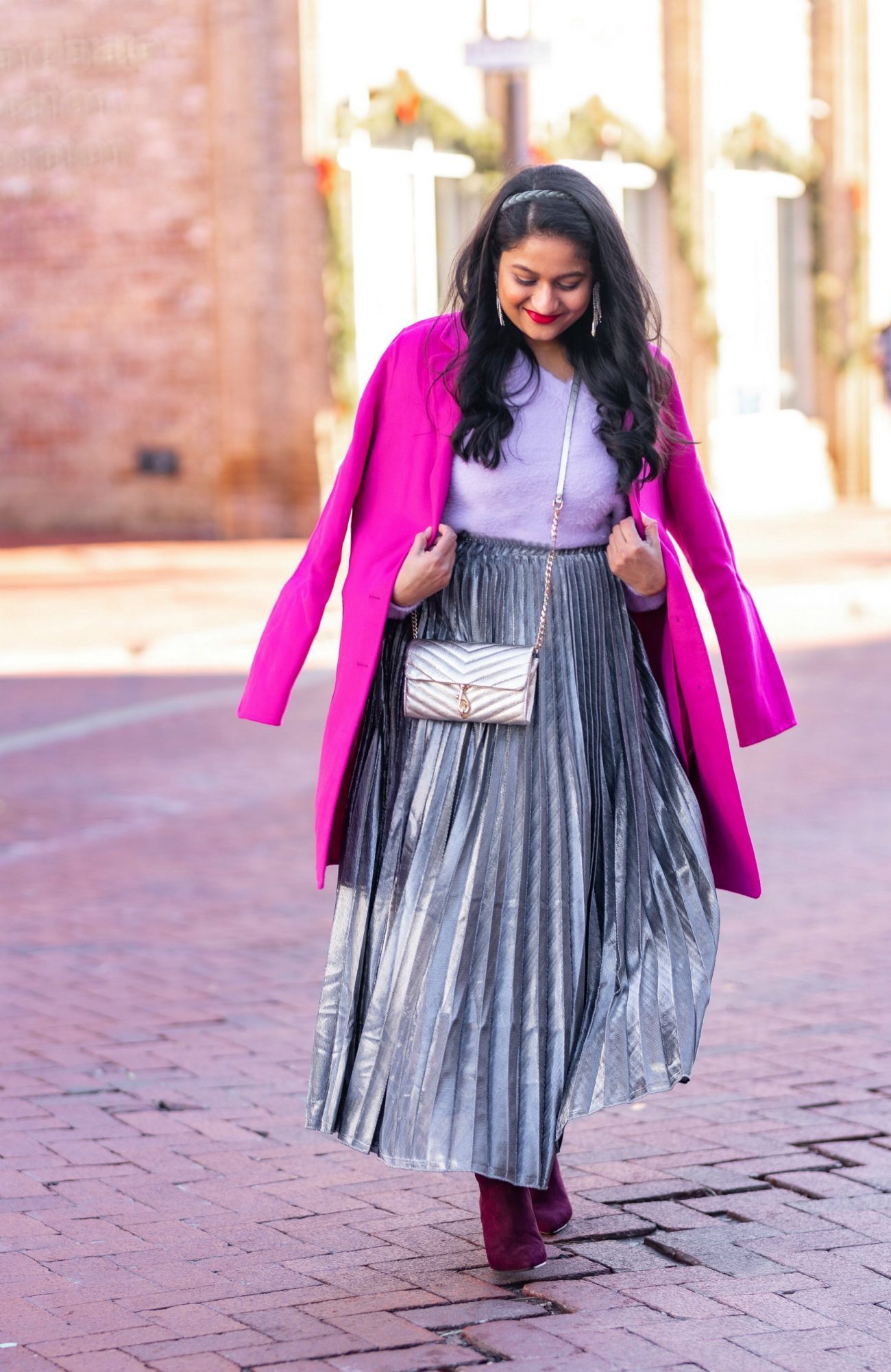 Amazon Holiday Fashion Favorites Under $50, featured by top US modest fashion blog, Dreaming Loud: image of a woman wearing Halogen Fuzzy V-Neck Sweater, amazon Silver pleated midi skirt,Banana Republic Topcoat in hot pink, Boden Burgundy knee high boots