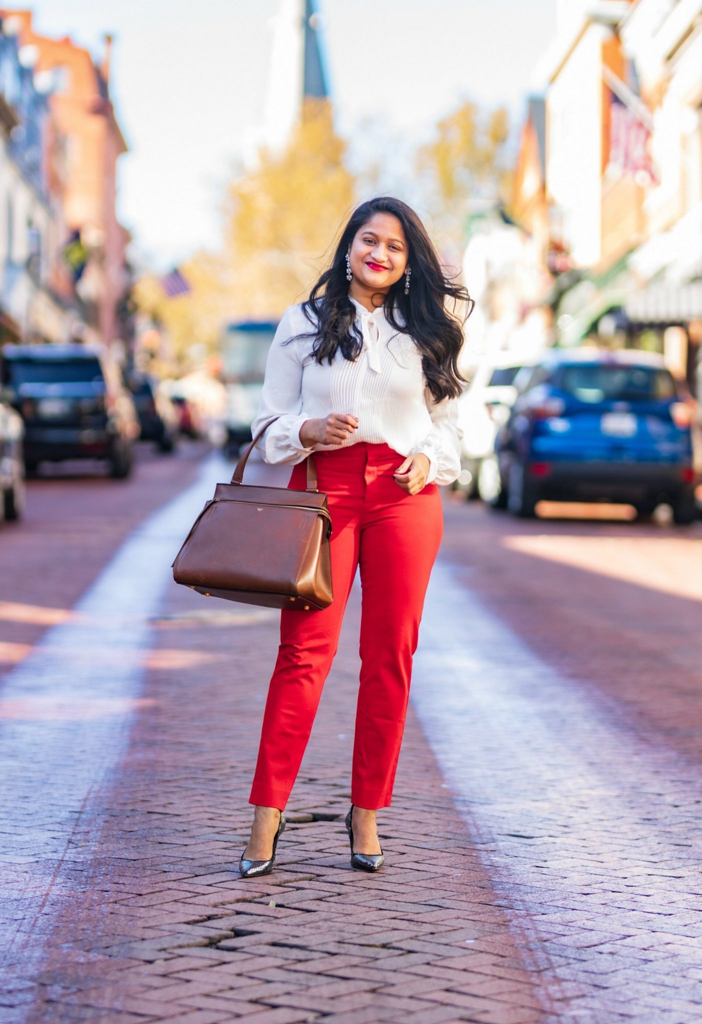 5 Cute Christmas Party Outfits by popular Maryland modest fashion blog, Dreaming Loud: image of a woman wearing wearing Lauren Ralph Lauren Single Breasted Reefer Coat, Banana republic red sloan trousers.