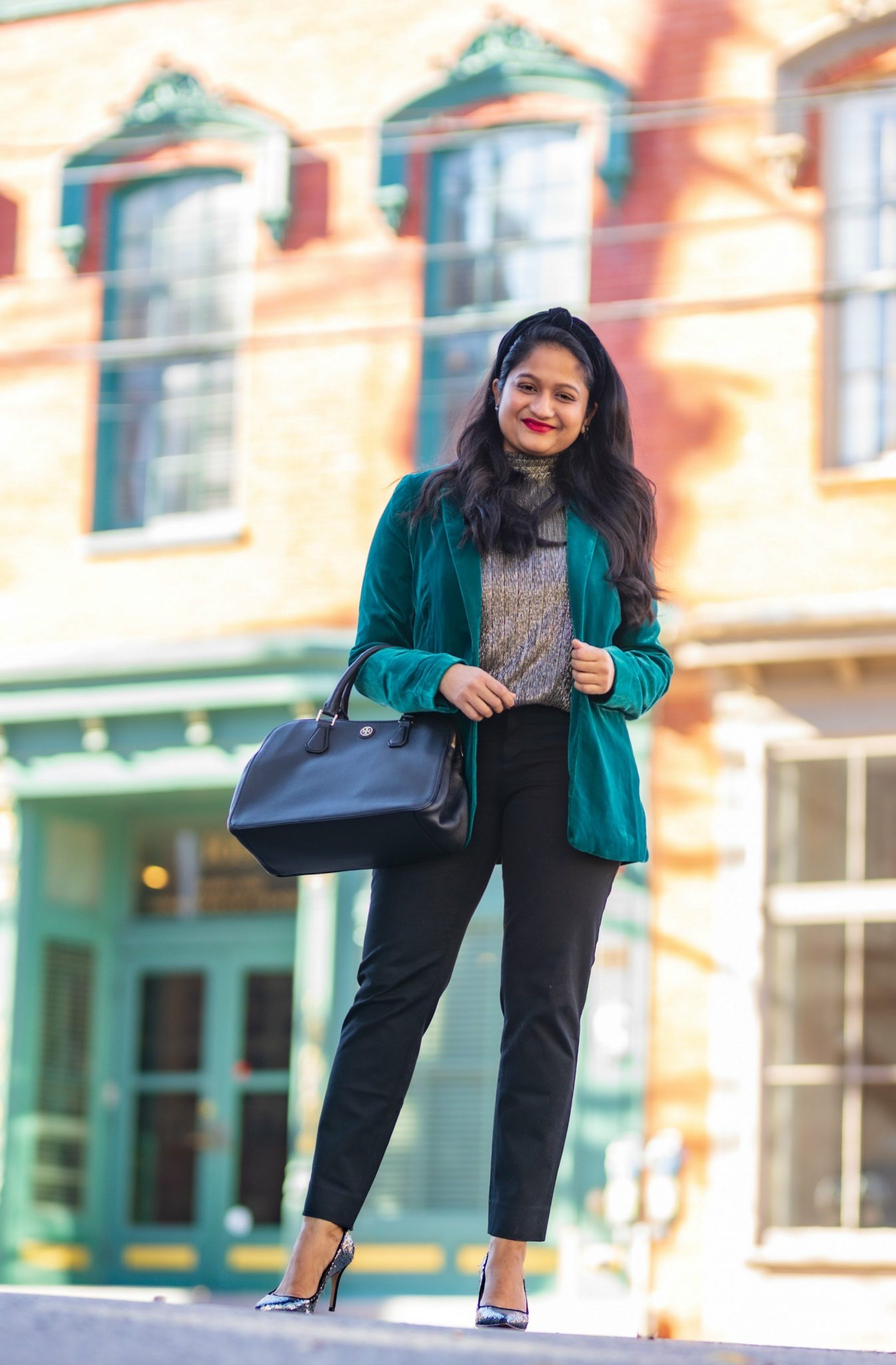 5 Cute Christmas Party Outfits by popular Maryland modest fashion blog, Dreaming Loud: image of a woman wearing INC International Concepts Velvet Blazer,Banana Republic. blaxk Trousers, metallic gold top, tory Burch robinson Tote