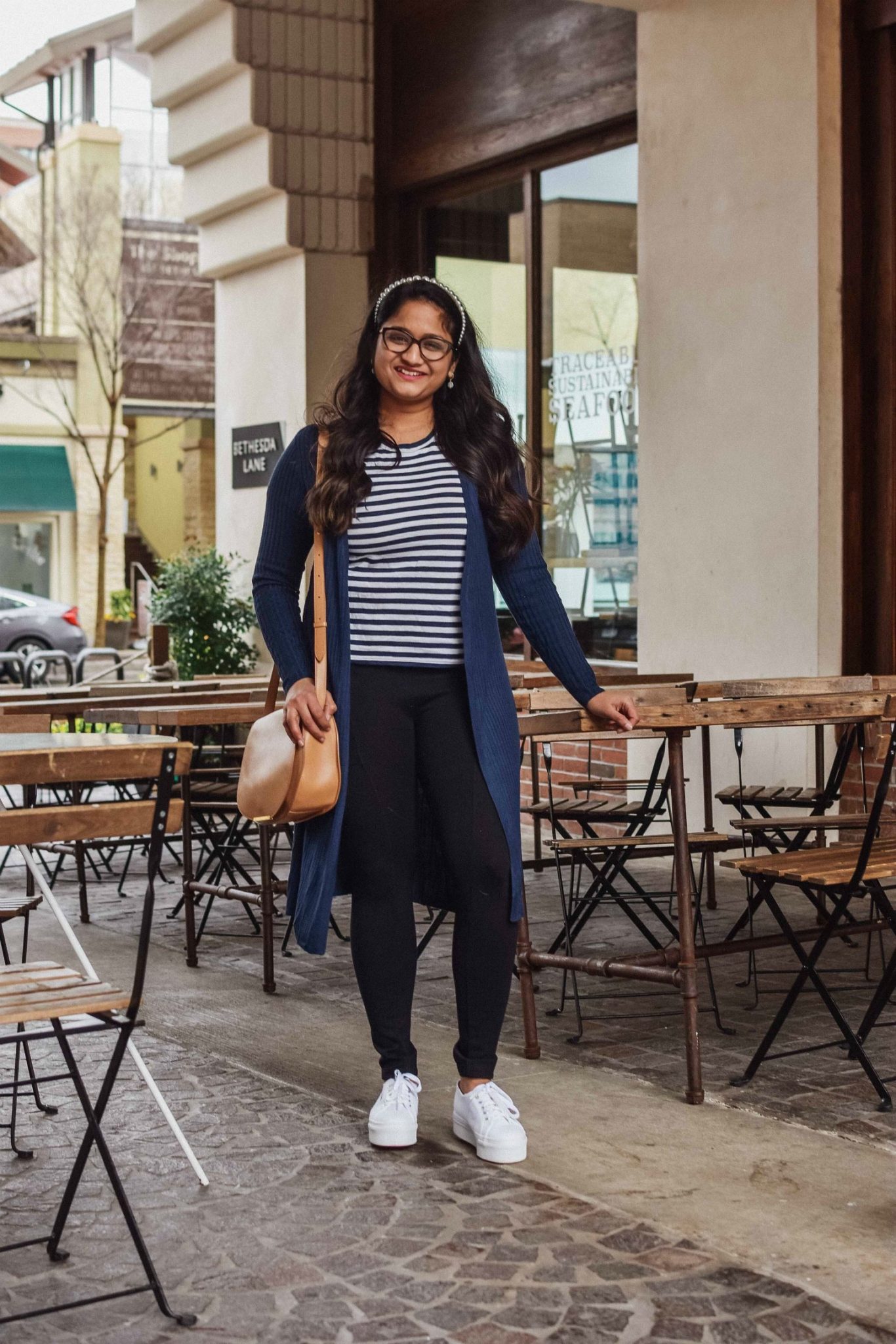 10 Winter Essentials For a Cozy Look featured by top Maryland modest fashion blogger, Dreaming Loud: image of a woman wearing Lou and Grey Travel Ponte Pocket Leggings, Everlane striped tee, INC Ribbed Duster Cardigan,Chuck Taylor All Star Ox Platform Sneake, Cuyana saddle bag