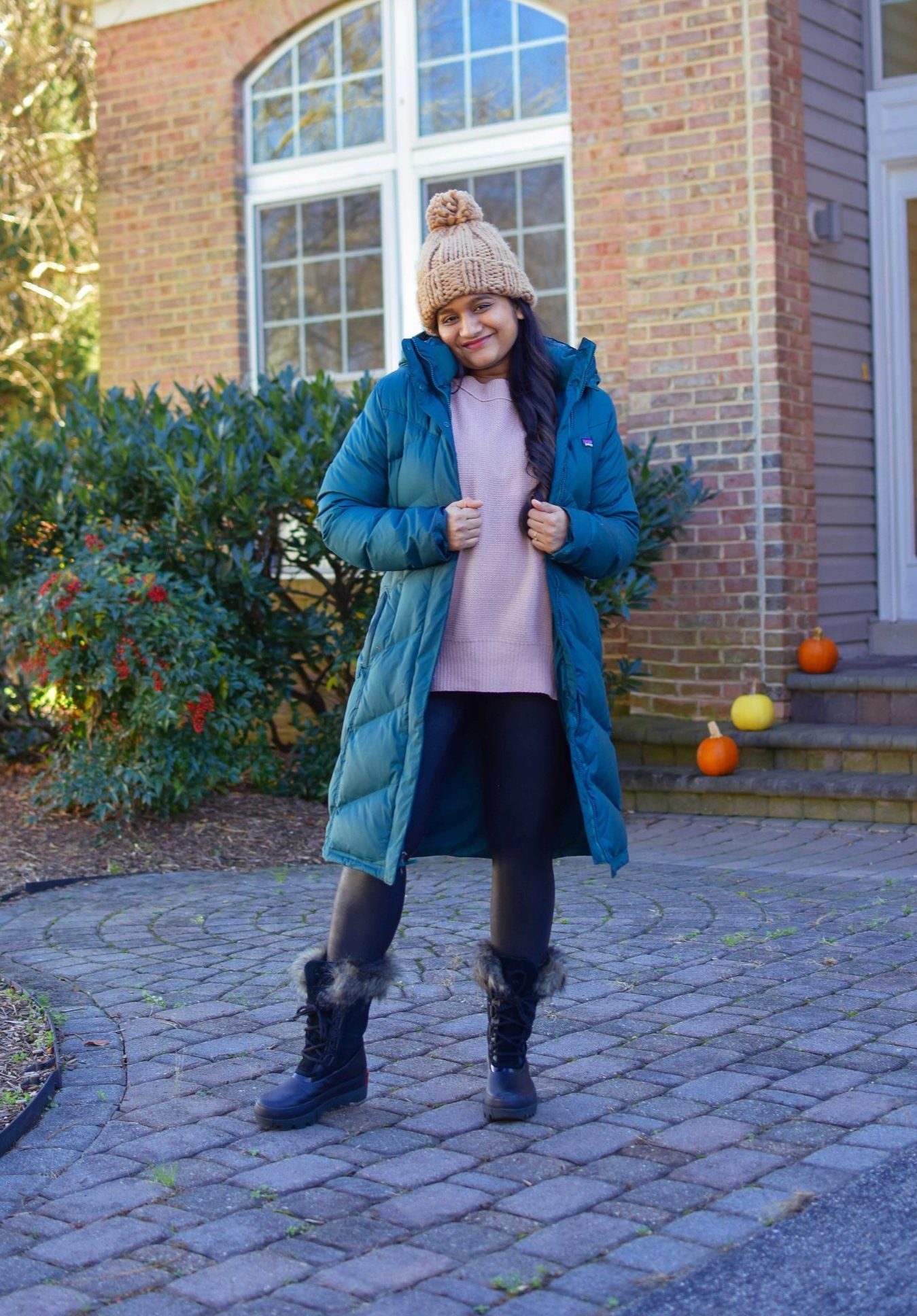 10 Winter Essentials For a Cozy Look featured by top Maryland modest fashion blogger, Dreaming Loud: image of a woman wearing Abercrombie oversized chenille sweater, Spanx faux leather legging, Sorel Joan Artic Next boots, Patagonia down it parka1-2