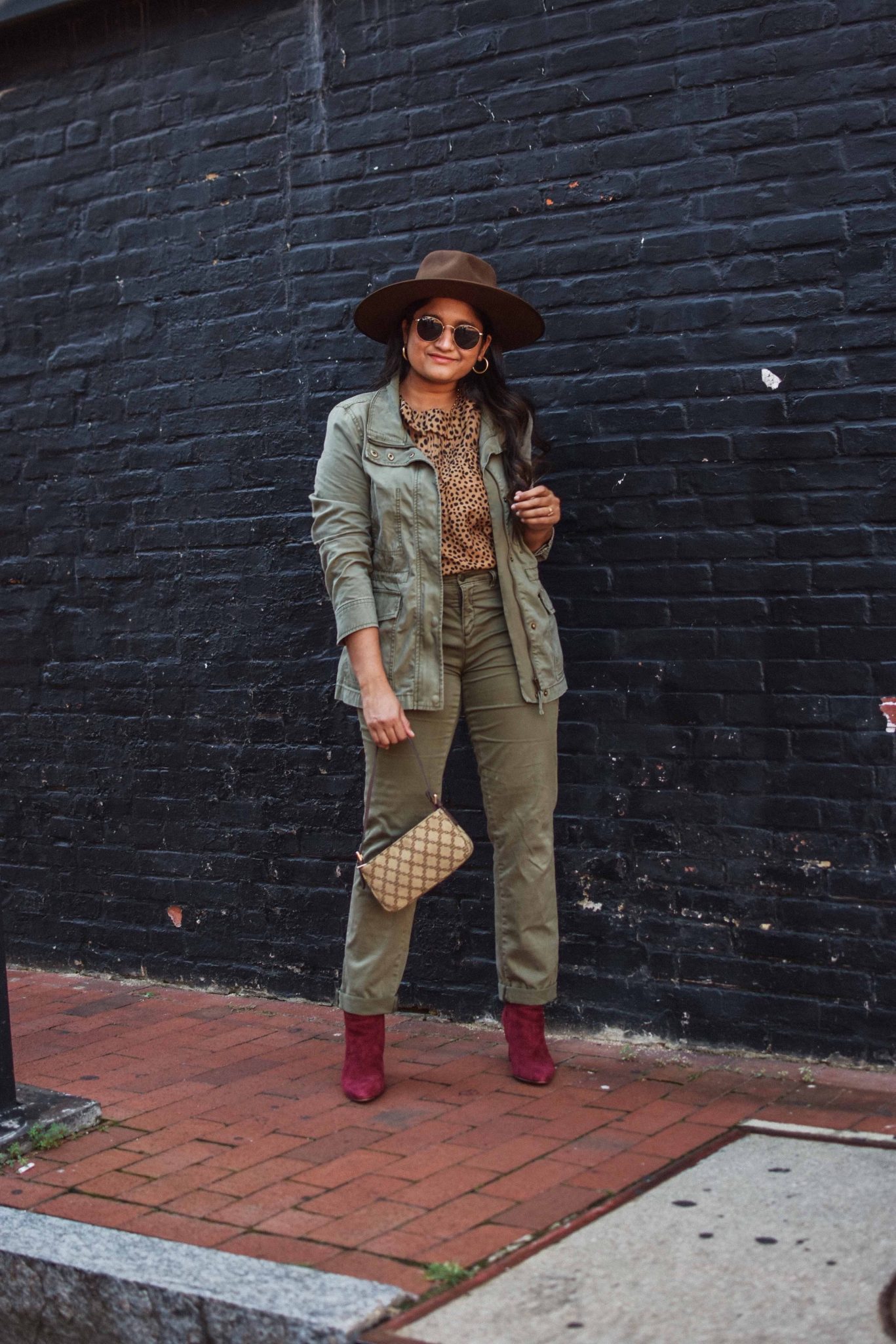 Wearing Caslon Crop Utility Pants, J.crew leopard print blouse,Madewell Passage Jacket, burgundy boots, lack of color brown hat |Utility Jackets by popular Maryland modest fashion blog, Dreaming Loud: image of a woman wearing aCaslon Crop Utility Pants, J.crew leopard print blouse, Madewell Passage Jacket, burgundy boots, lack of color brown hat.