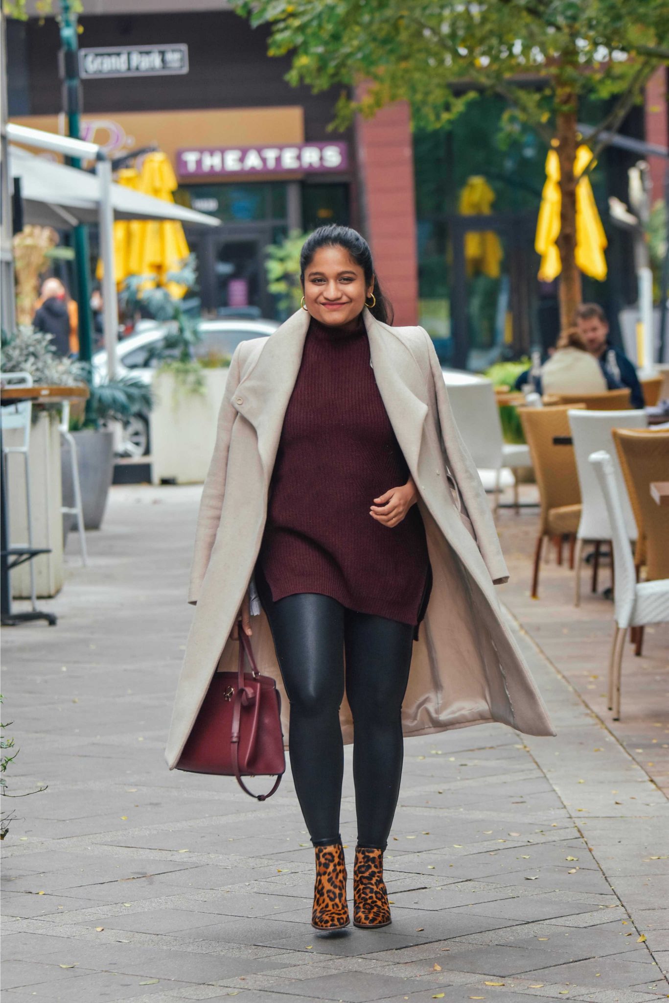 10 Winter Essentials For a Cozy Look featured by top Maryland modest fashion blogger, Dreaming Loud: image of a woman wearing wearing Spanx Faux leather legging, Mango belted Wrap coat in Ecru, madewell Regan Boot in Leopard-maternity style 6