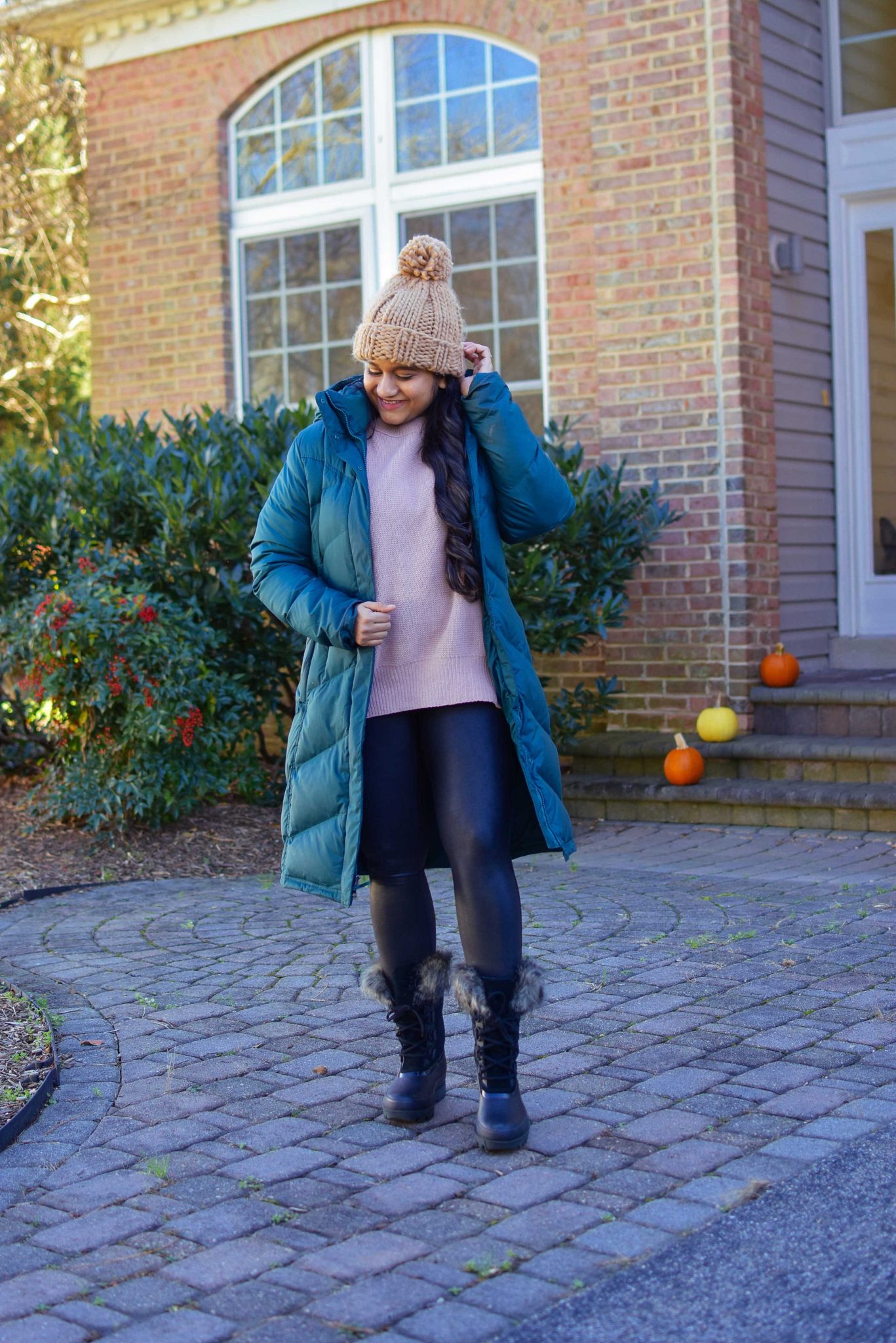 10 Winter Essentials For a Cozy Look featured by top Maryland modest fashion blogger, Dreaming Loud: image of a woman wearing Abercrombie oversized chenille sweater, Spanx faux leather legging, Sorel Joan Artic Next boots