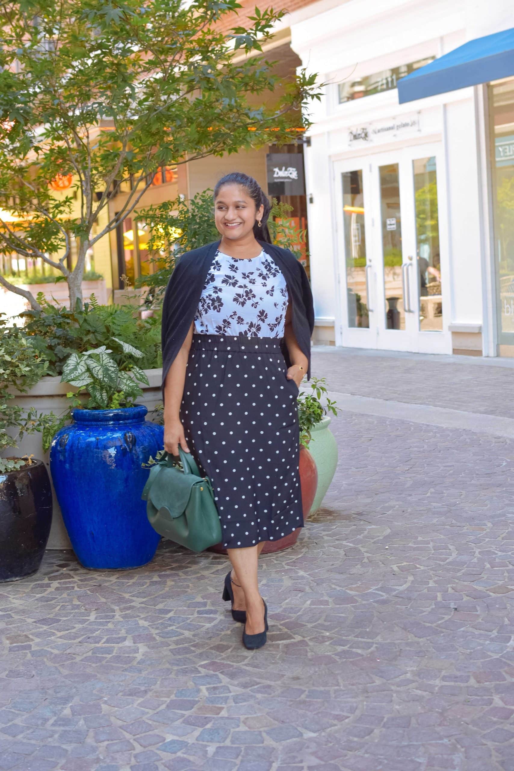 Wearing J.crew factory slip on polka dot skirt, floral shell top, J.crew Factory Classic cotton cardigan sweater, J.crew black pumps, Polene numero un in trio green