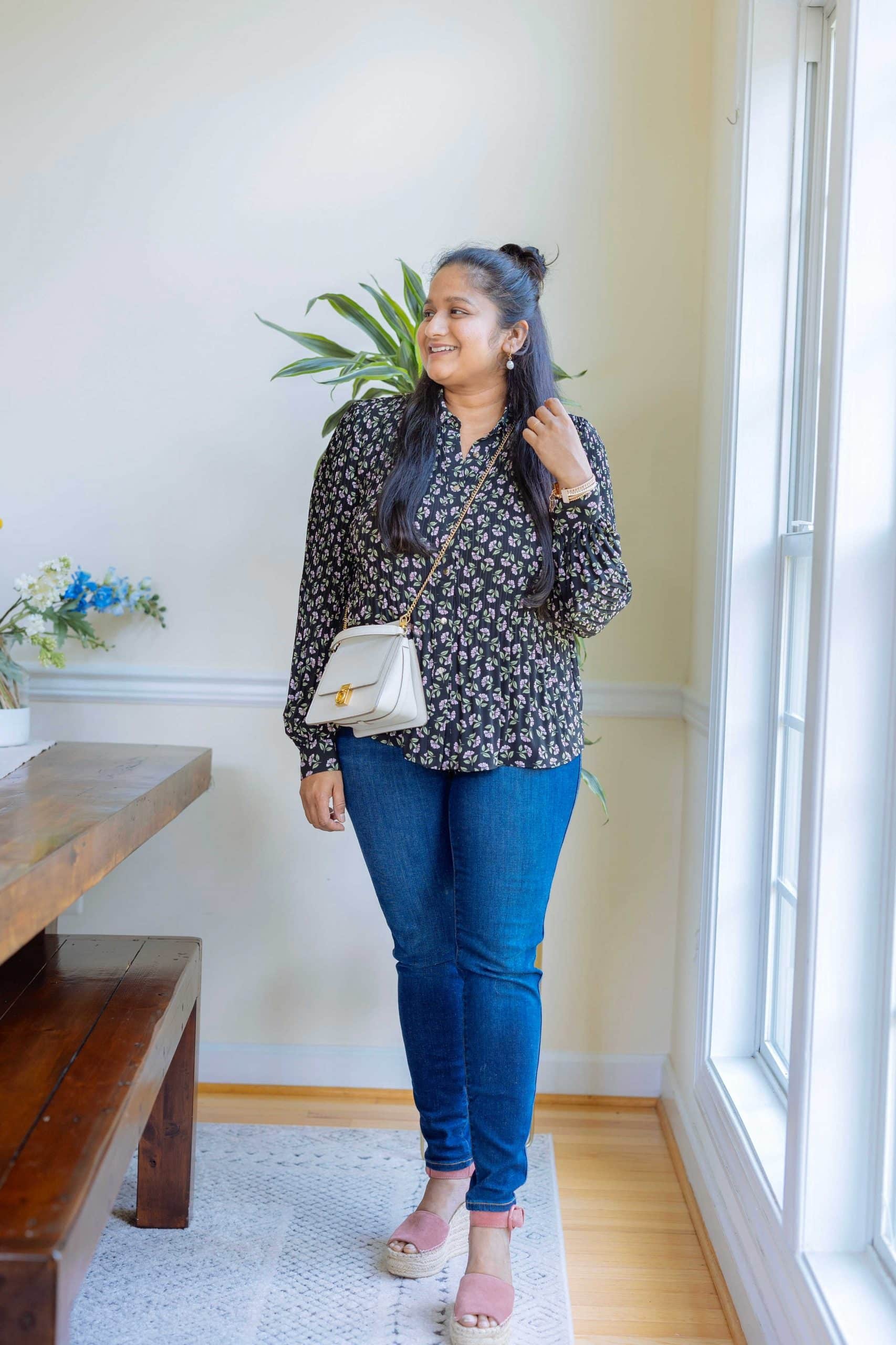 Wearing Tahari Floral-Print Pleated Blouse,Spanx Ankle Skinny Jeans, Midnight Shade, Marc Fisher pink wedges, Victoria Emerson Alejandra bracelet, Polene Numero Sept Mini in chalk