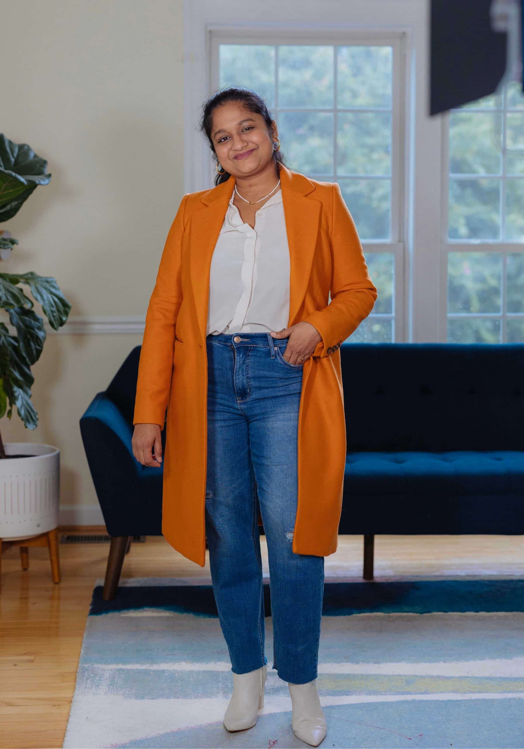 Orange Coat Fall Outfit- wearing Mango Orange coat, .KUT Straight leg jeans,Everlane The Clean Silk Relaxed Shirt, marc fisher Ulani booties by top Modest fashion blogger dreaming loud