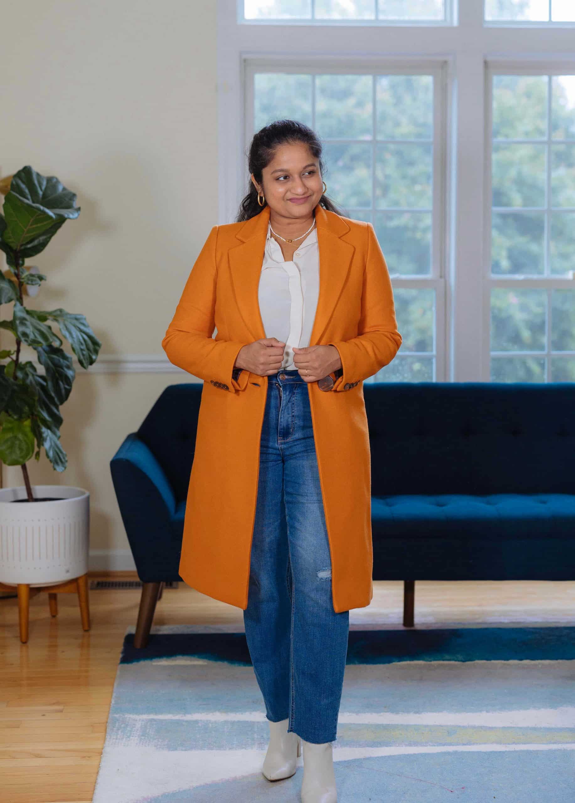 Orange Coat Fall Outfit- wearing Mango Orange coat, .KUT Straight leg jeans,Everlane The Clean Silk Relaxed Shirt, marc fisher Ulani booties by top Modest fashion blogger dreaming loud