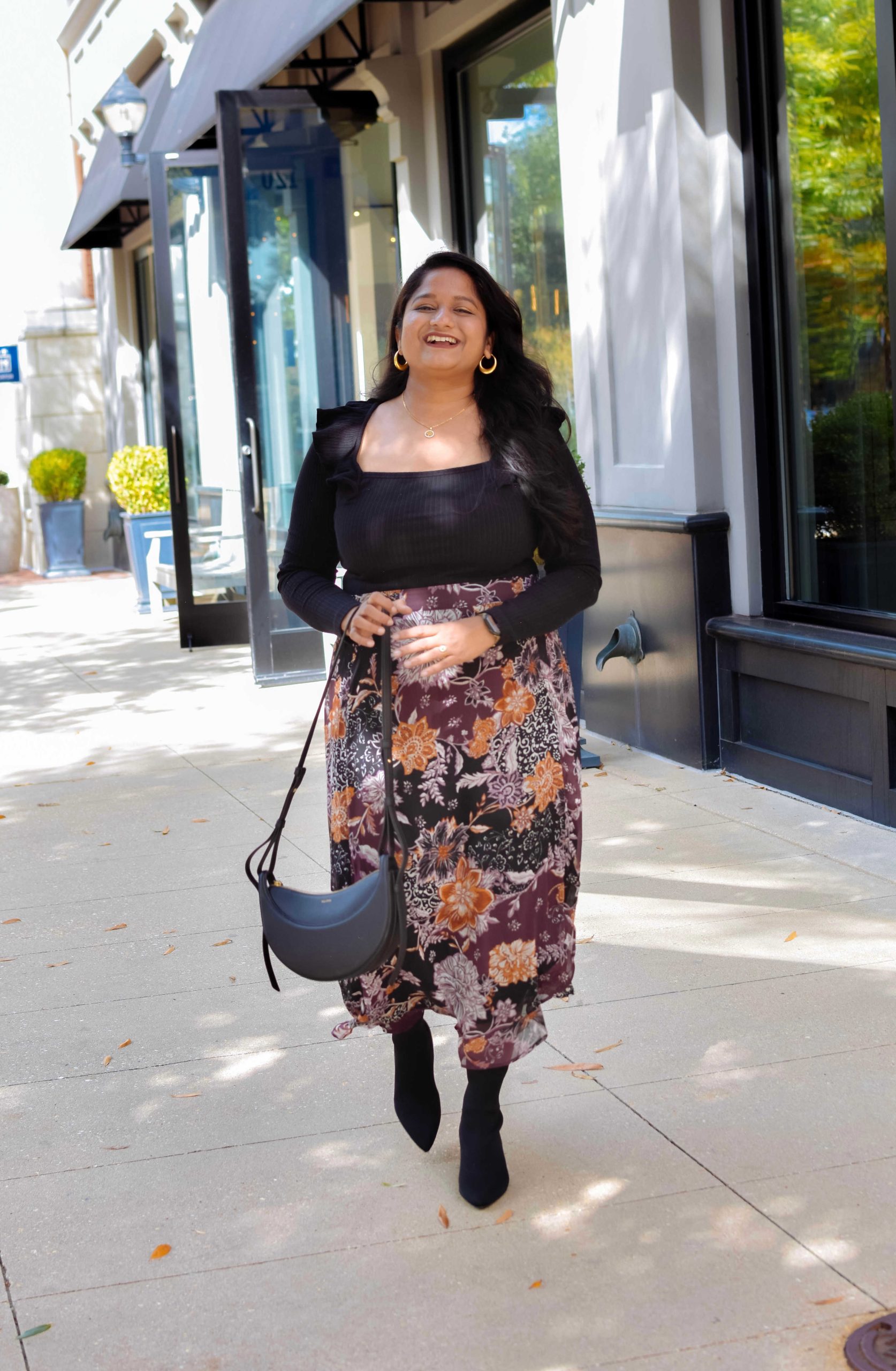 5 Cute Thanksgiving Outfit Ideas for Mid-Size Beauties - Wearing Maurices Briar Faux Wrap Skirt, Loft Pointelle Ruffle Square Neck Top, Veronica Bread Leeland Pointed Toe Chelsea Boot by top US mid-size fashion blog Dreaming Loud. Click to shop 