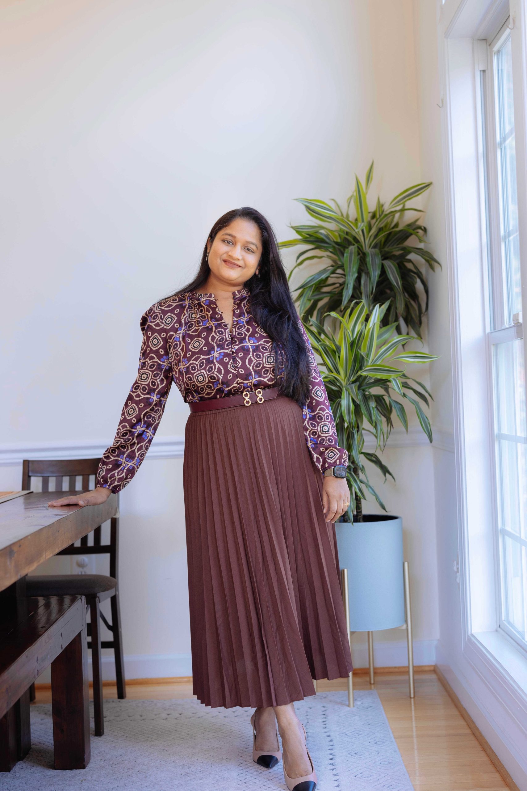 5 Cute Thanksgiving Outfit Ideas for Mid-Size Beauties - Wearing burgundy pleated skirt, Steve Madden Kling Tan leather heels, Ann Taylor Ruffle Neck Top by Top US Mid-size Fashion Blogger Dreaming Loud Click to Shop