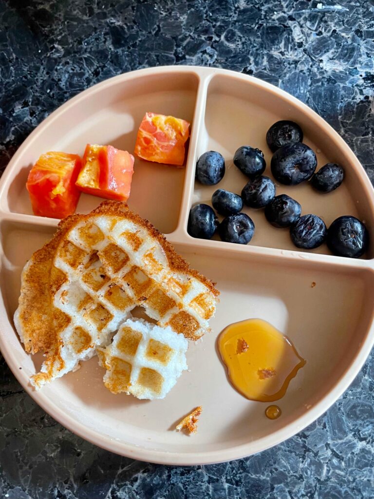 Quick and Healthy Toddler Snack Ideas and Recipes- Waffle with idly dosa batter with maple syrup and papaya by Top US Mom Blog Dreaming Loud