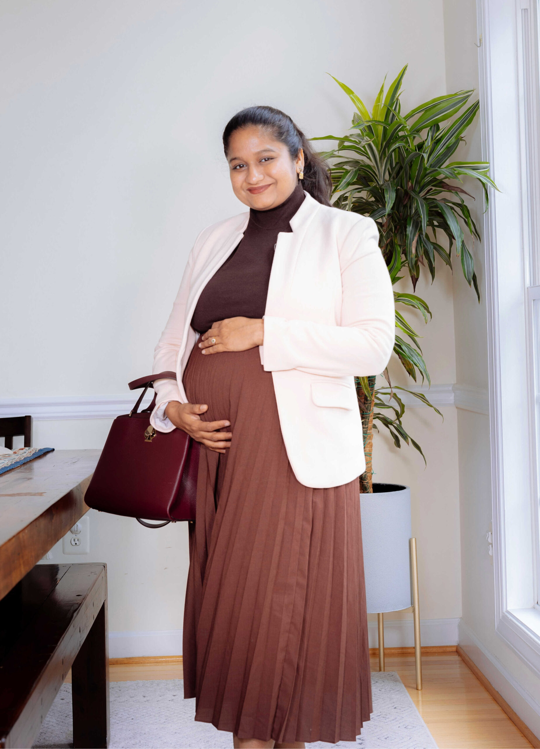 Cozy-Chic Fall Pregnancy Outfit Ideas- Wearing Uniqlo Pleated skirt in burgundy, Gibson Notch Collar Blazer In Pearl Blush by Top Us Mom Fashion Blogger Dreaming Loud