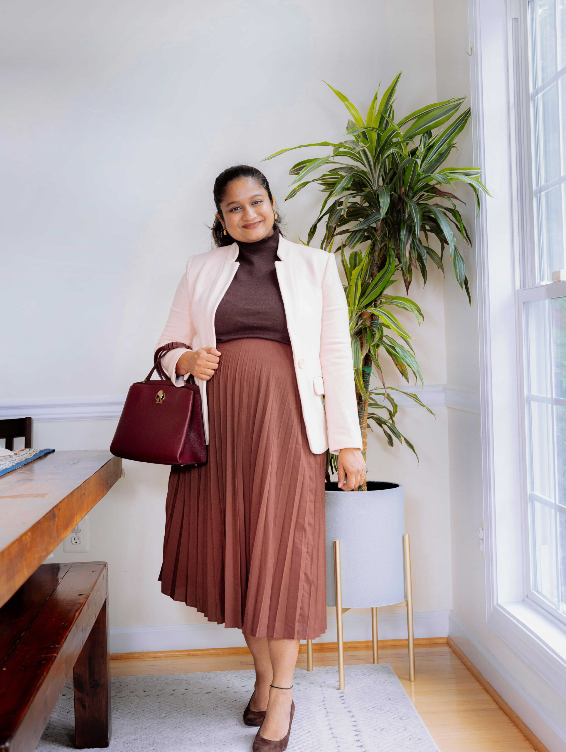 Cozy-Chic Fall Pregnancy Outfit Ideas- Wearing Uniqlo Pleated skirt in burgundy, Gibson Notch Collar Blazer In Pearl Blush by Top Us Mom Fashion Blogger Dreaming Loud