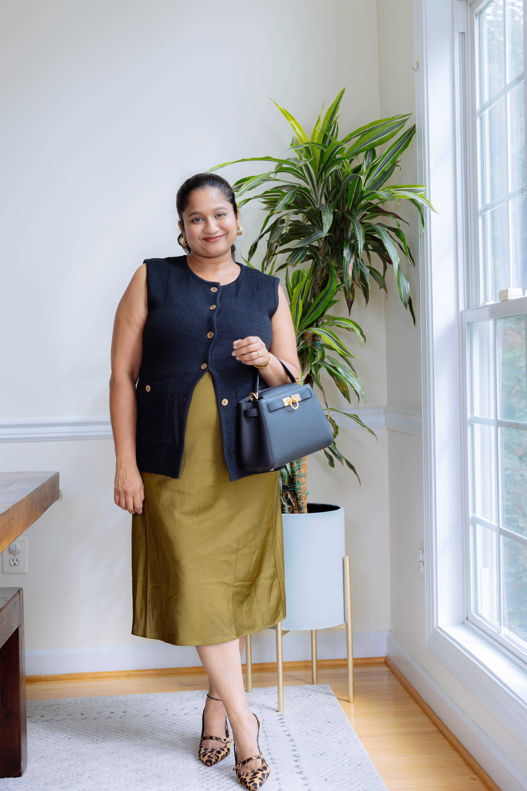 Fall Pregnancy Outfit Ideas- One quince slik skirt, Amazon Fashion Knit Vest, Parisa Wang Madison Micro Top Handle Bag,J.crew Leopard print heels by Top US Mom Blogger Dreaming Loud