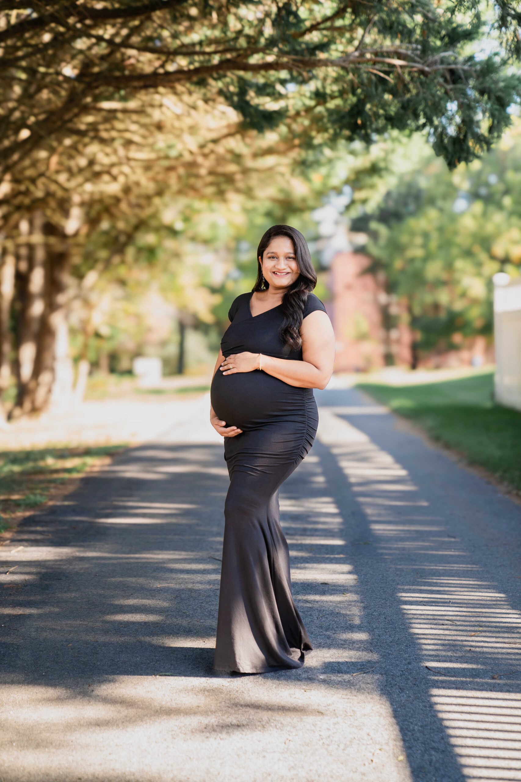 Your Ultimate Guide to What to Wear to A Maternity Shoot - Wearing Pinkblush Maternity Black Off Shoulder Wrap Maternity Photoshoot Dress by Top US Mom Blogger Dreaming Loud