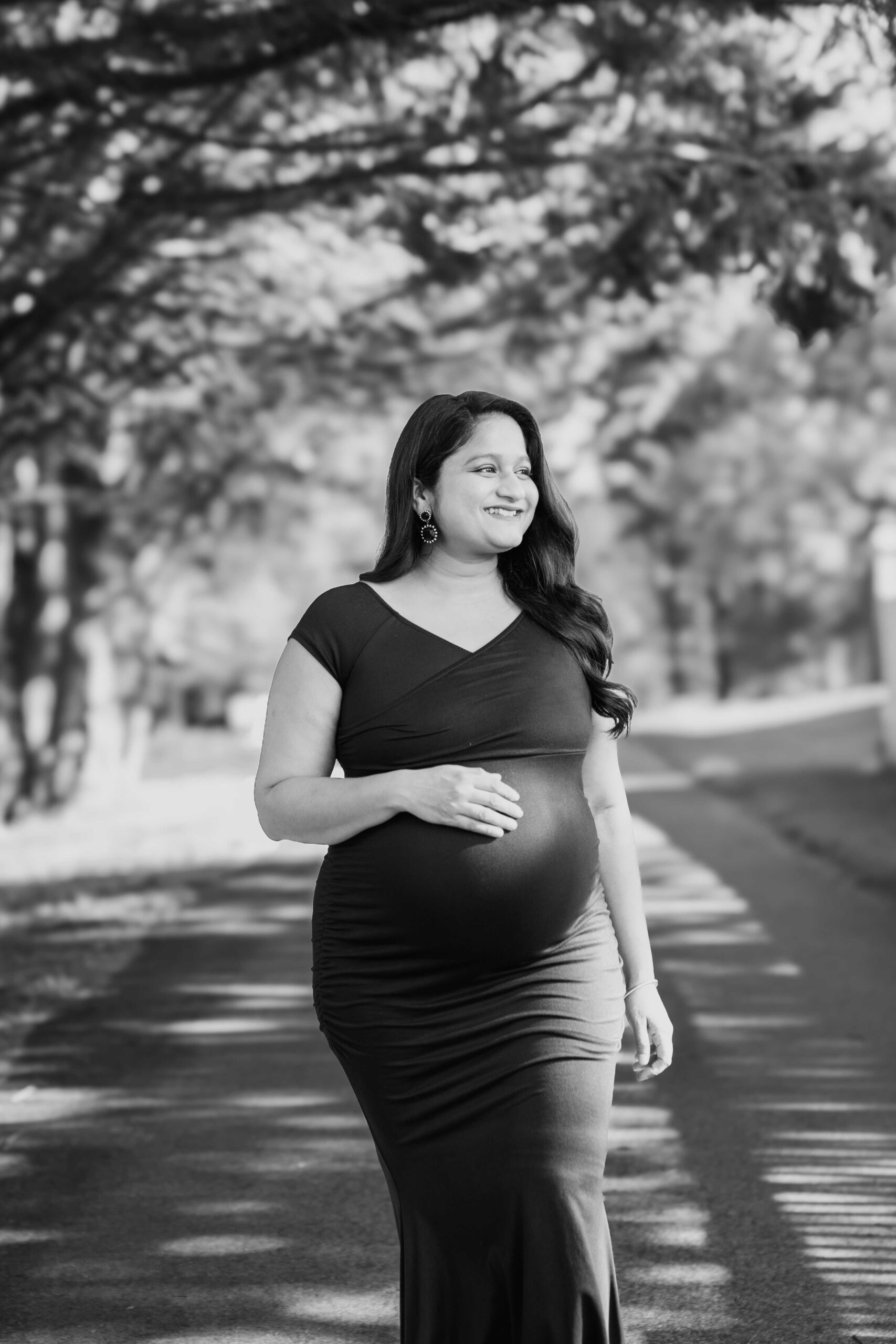 Your Ultimate Guide to Stunning Maternity Shoot Dresses - Wearing Pinkblush Maternity Black Off Shoulder Wrap Maternity Photoshoot Dress by Top US Mom Blogger Dreaming Loud