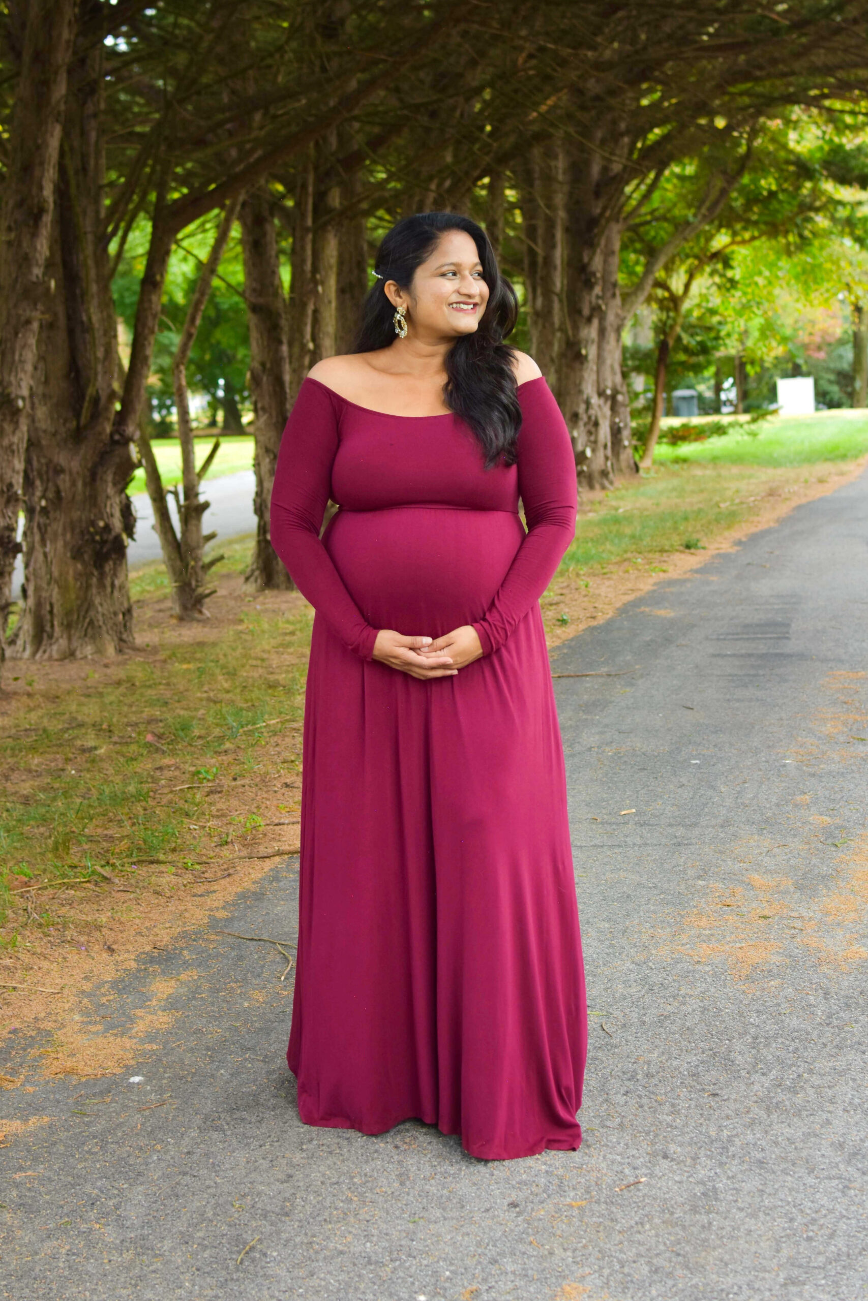 Your Ultimate Guide to Stunning Maternity Shoot Dresses - wearing Pinkblush maternity Dark Burgundy Solid Off Shoulder Maternity Maxi Dress