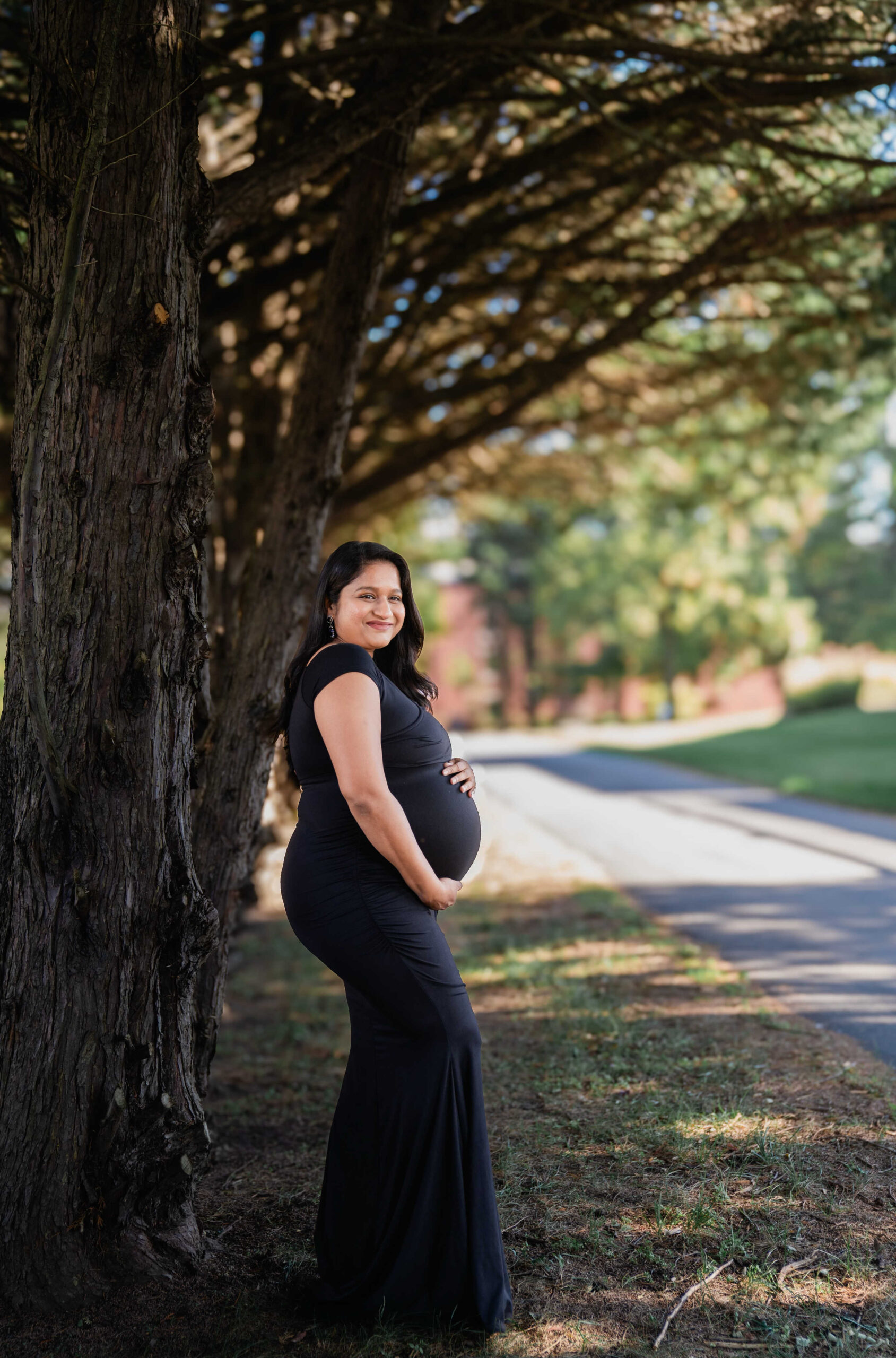 Your Ultimate Guide to What to Wear to A Maternity Shoot - Wearing Pinkblush Maternity Black Off Shoulder Wrap Maternity Photoshoot Dress by Top US Mom Blogger Dreaming Loud